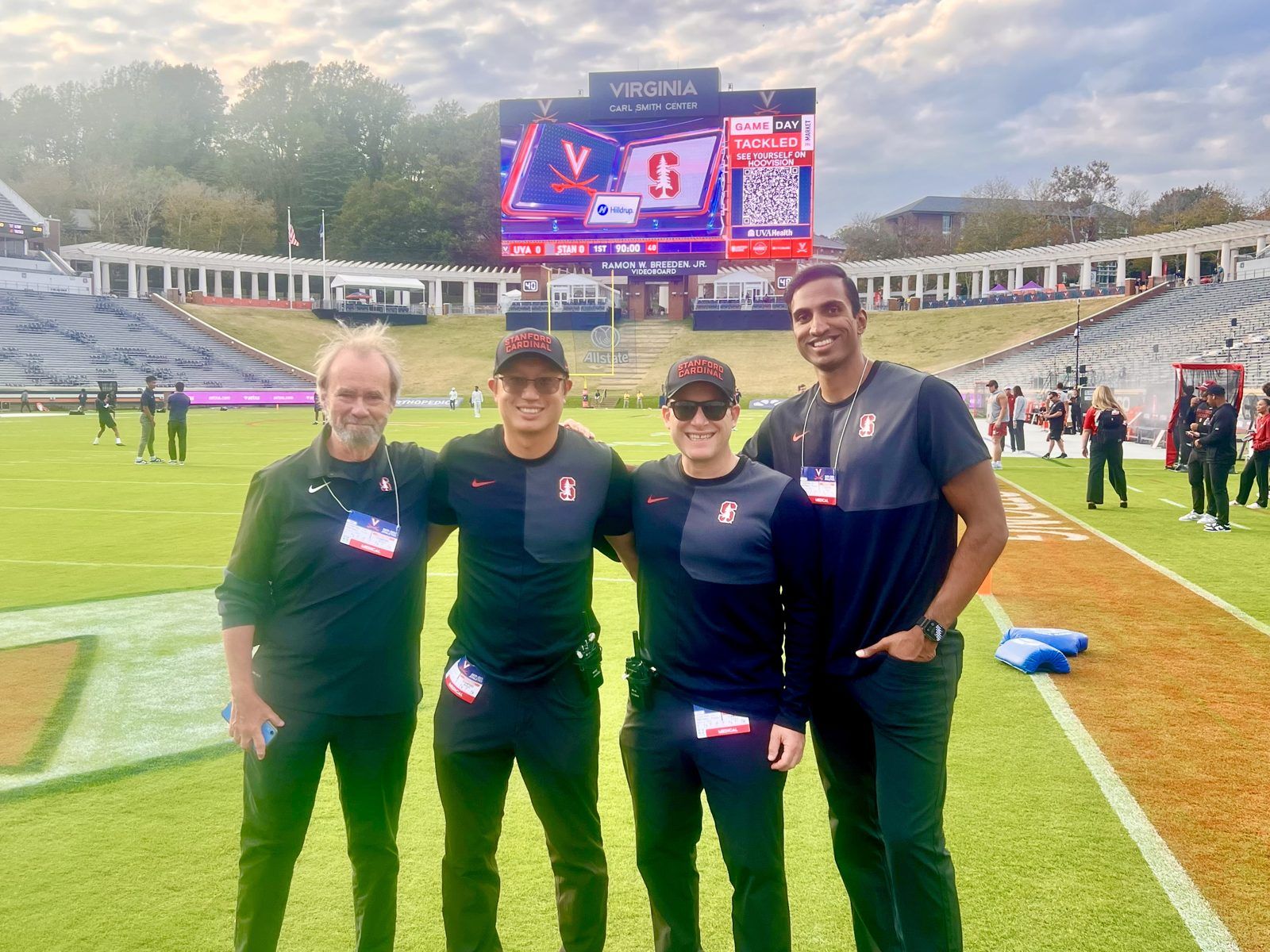 Dr. Tummala with the Stanford football medical team on the field at Virginia